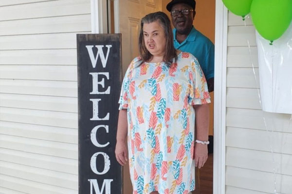 Colson Family in Dream Home Doorway